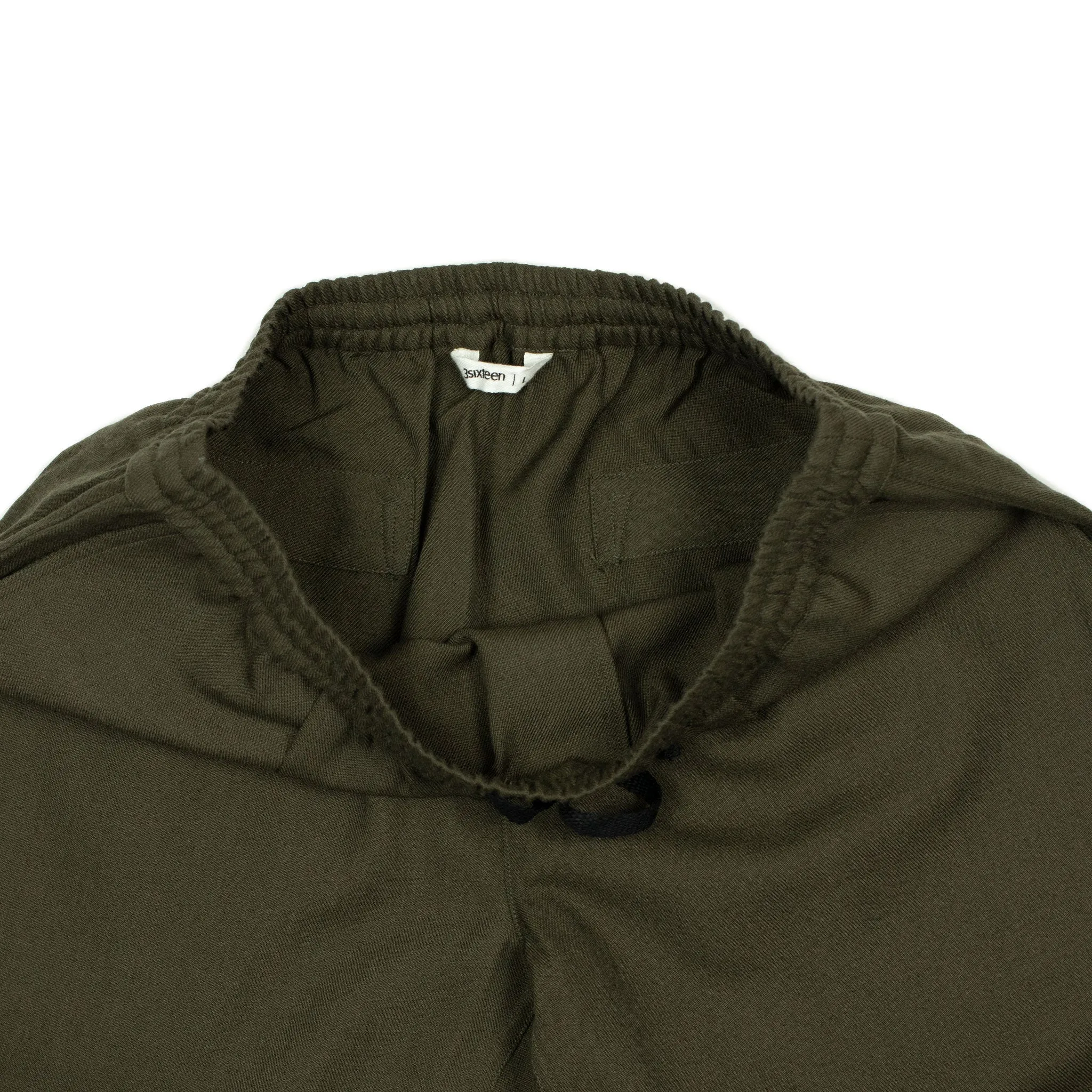 Drawstring trousers in forest green wool gabardine